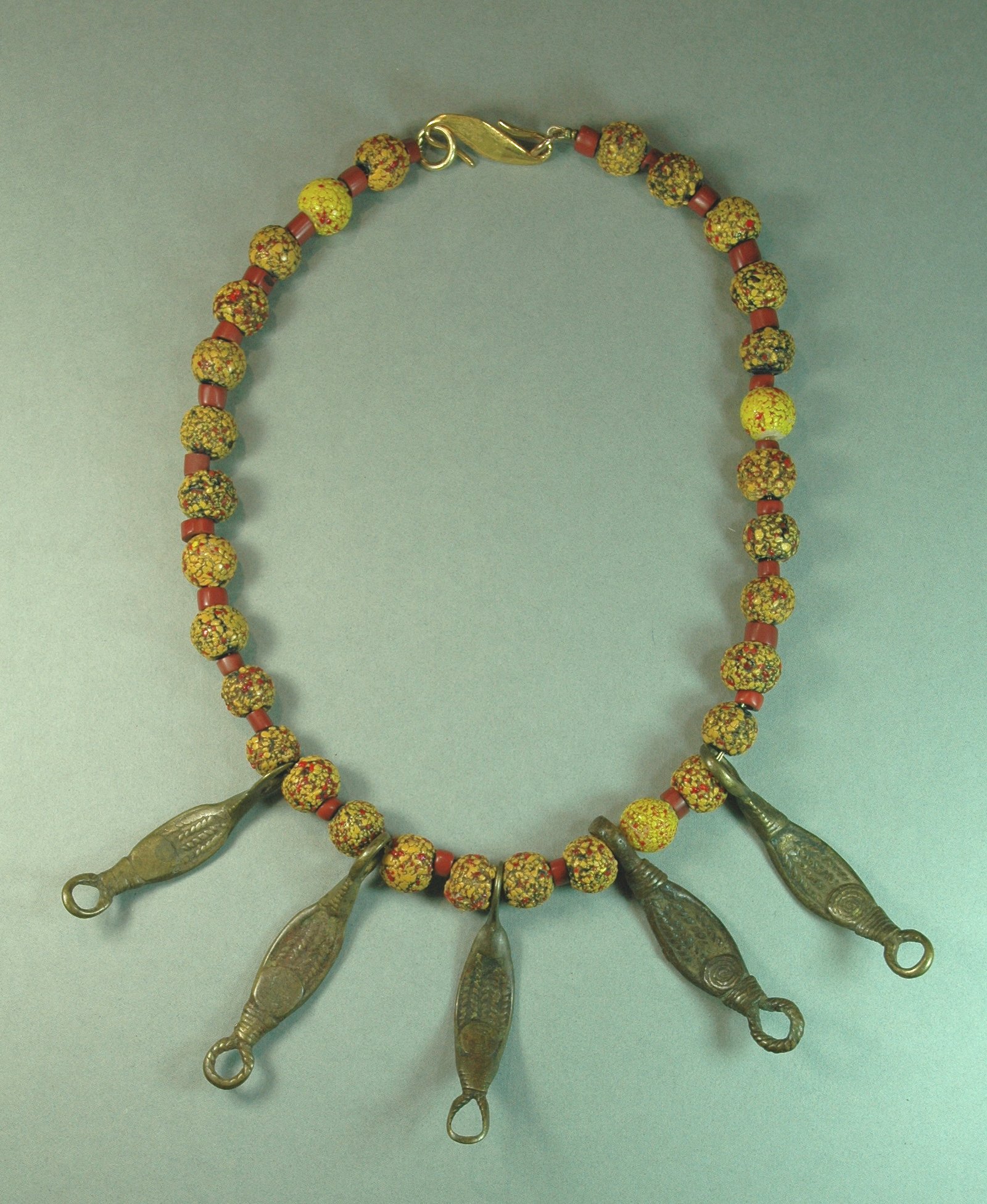 Beads from Venice and bronze pendants